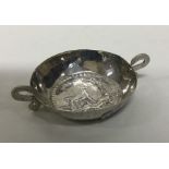 A Continental silver pin dish decorated with anima