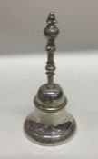A Continental silver table bell with engraved deco