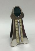 A novelty silver thermometer / photo frame of styl