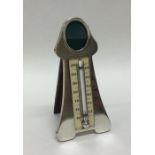 A novelty silver thermometer / photo frame of styl