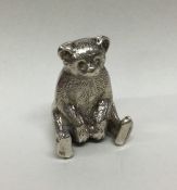 CHESTER: A silver figure of a teddy bear with text