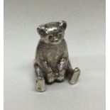 CHESTER: A silver figure of a teddy bear with text