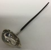 A Georgian silver toddy ladle with coin centre and