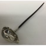 A Georgian silver toddy ladle with coin centre and