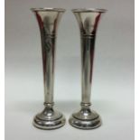 A pair of Edwardian silver tapering spill vases wi