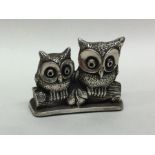 A Continental silver figure of owls seated upon a