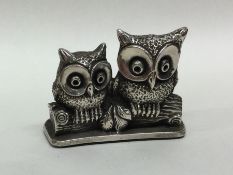 A Continental silver figure of owls seated upon a