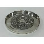 A Victorian silver pin dish with chased decoration