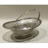 A heavy Edwardian silver swing handled basket with