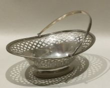 A heavy Edwardian silver swing handled basket with