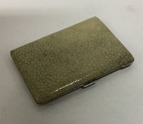 A heavy shagreen and silver cigarette case with gi