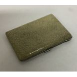 A heavy shagreen and silver cigarette case with gi