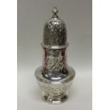 A heavy silver baluster shaped half fluted caster