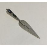 A small silver bookmark with hard stone handle. Bi