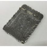 A Victorian silver card case engraved with flowers