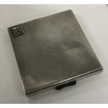 A heavy Art Deco silver cigarette case with reeded