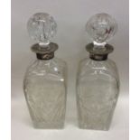 A good pair of Edwardian silver and glass mounted