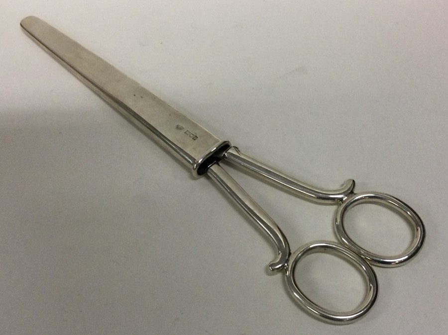 A good pair of large silver scissors contained wit