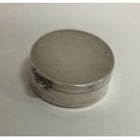A circular silver pill box of plain form. Birmingh