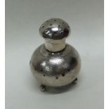 A Chinese silver pepper of textured form. Approx.