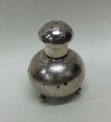 A Chinese silver pepper of textured form. Approx.