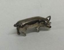 A heavy cast silver figure of a pig. Approx. 17 gr