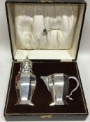 A good quality Edwardian cased silver cream and su