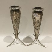 A pair of Chinese silver spill vases of typical ba