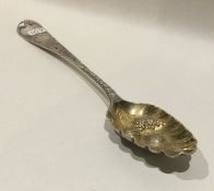 A good Georgian bright cut silver berry spoon deco