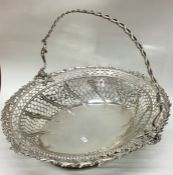 A good cast Georgian silver basket with pierced de