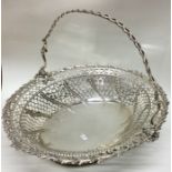 A good cast Georgian silver basket with pierced de