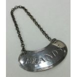 An unusual oval Georgian silver wine label for 'Br
