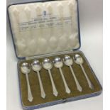 A heavy set of six silver coffee spoons. Various d