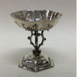 A Continental silver table toy decorated with scro