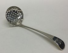 A crested silver sifter spoon. London 1821. By Wil