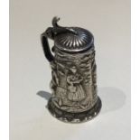 A small Dutch silver lidded tankard with chased de