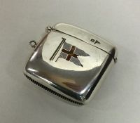 A silver vesta case with enamelled decoration. She