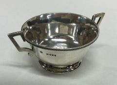 A Victorian silver two handled salt engraved with