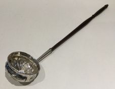 A good Georgian chased silver toddy ladle with tur