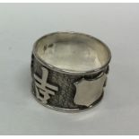 A heavy Chinese silver napkin ring of typical form