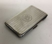 A heavy silver engine turned card case with gilt i