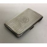 A heavy silver engine turned card case with gilt i