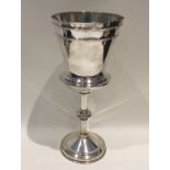 A heavy Edwardian silver tapering goblet of reeded
