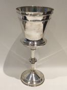 A heavy Edwardian silver tapering goblet of reeded