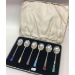 An attractive set of six silver and enamelled Art