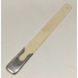 A silver and ivory mounted paperknife of stylish f