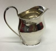 An Edwardian silver helmet shaped cream jug with r
