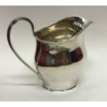 An Edwardian silver helmet shaped cream jug with r