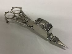 A good Georgian silver candle snuffer attractively