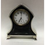 An Edwardian silver and tortoiseshell clock with w